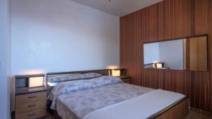 a bedroom with two beds and a mirror at House Katarina by Villas Guide in Blato