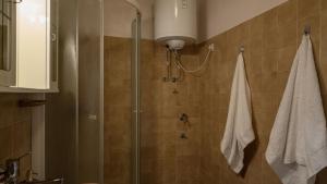 a bathroom with a shower with a glass door at House Katarina by Villas Guide in Blato +14 photos
