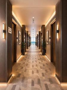 a hallway of a hotel with at Click Hotels Lite Chakan in Pune +49 photos