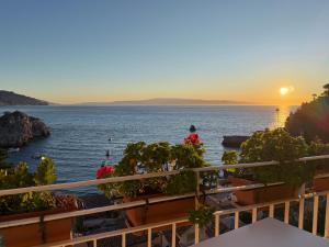 a view of the ocean at sunset from a restaurant at Paradise By The Sea in Taormina