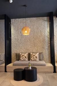 a living room with a couch and a table at Bayer's City Hotel in Munich