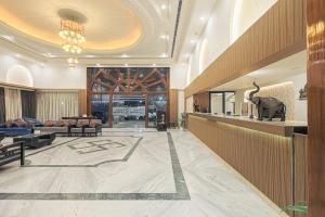 a lobby of a hotel with an elephant on the floor at Hotel Nivaara By VYDA in Tirupati +79 photos