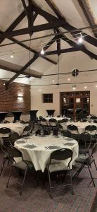 a banquet hall with white tables and chairs at Hotel Golf de Pierpont in Bons Villers +27 photos