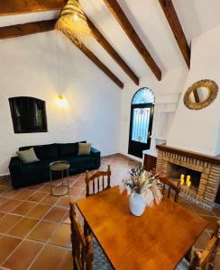 a living room with a table and a couch at AIRE Vejer - recién reformado 2026 in Vejer de la Frontera