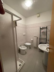 a bathroom with a toilet and a sink and a shower at Casa Le Campane sulla Via Francigena in Gambassi Terme