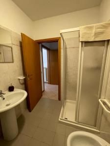 a bathroom with a shower and a sink and a toilet at Casa Le Campane sulla Via Francigena in Gambassi Terme