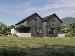 a black house on a hill with a green field at NOOK - Nature Hideaway in Bad Aussee