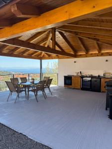 a kitchen and dining room with a table and chairs at Villa Petra in Kastav