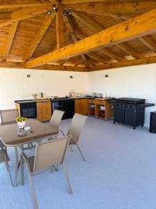 a kitchen with a table and chairs in a room at Villa Petra in Kastav
