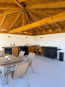 a kitchen with a table and chairs in a room at Villa Petra in Kastav +24 photos
