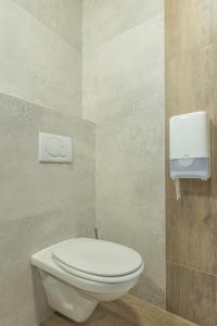 a bathroom with a white toilet in a room at Tourist farm Mulej in Bled +102 photos