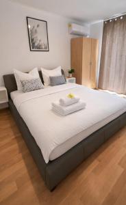 a large bed in a room with a large white mattress at GUESTHOUSE Kastel Novi 2 More Space in Kaštela