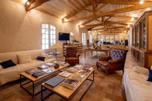 a living room with a couch and a table at Château du Tertre in Arsac