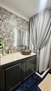 a bathroom with a sink and a mirror at Maison de Luxe in Chalkida +23 photos