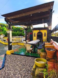 a patio with a table and a house at Somonte Costa in Santander