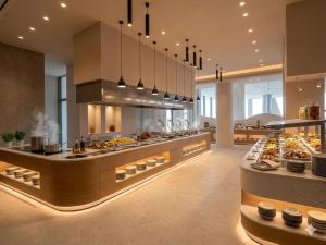 a bakery with many different types of food on display at Venus Beach Hotel in Paphos