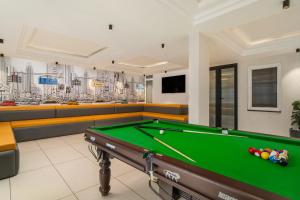 a billiard room with a pool table at Country Inn Smart Stays, Rishikesh at Tapovan in Rishīkesh