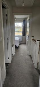 an empty room with a bed and a window at Private room in a 2-bedroom house in Dinnington