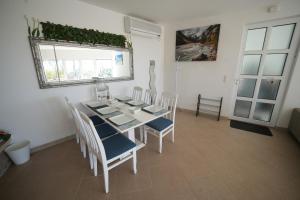 a dining room with a table and chairs and a window at Vila Brca in Brca