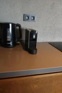 a coffeemaker and a coffee pot sitting on a counter at Yalikavak Manzarali Villa in Bodrum City