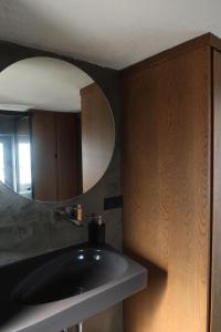 a bathroom with a sink and a mirror at Yalikavak Manzarali Villa in Bodrum City