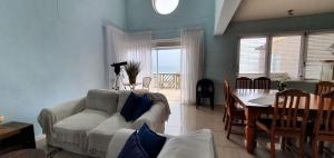 a living room with a couch and a table at CUTTY SARK in Langstrand