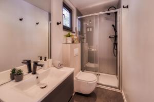 a bathroom with a toilet and a sink and a shower at Sea view SanNor by Vellaris, Luxury Mobile Home in Mali Lošinj +48 photos