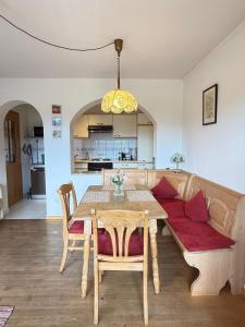 a living room with a table and a couch at Abendsonne in Krün