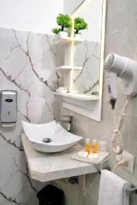 a bathroom with a sink and a mirror at Italo House in Opera