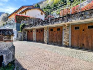 a row of wooden garage doors on a building at Al Funtanin in San Siro