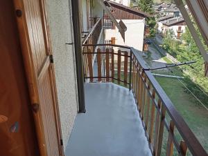 a balcony with a view of a street at Castori due in Prazzo