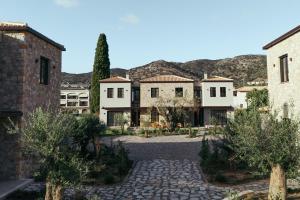 arial view of a house with mountains in the background at Képos Villas Sivota in Syvota