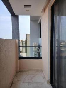 an empty balcony with a view of a building at le laurier 9 in Abidjan
