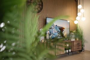 a living room with a flat screen tv at MariZot Apartment in Alexandroupoli