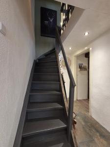 a staircase in a house with a stair case at Der kleine Eifel-Ritter in Manderscheid