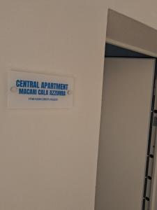 a sign on the wall of a hospital bathroom at Macari Residence Central Apartment in Macari