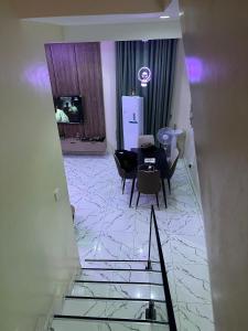 a view of a room with a table and chairs at Floesth Ville in Mama