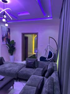 a living room with a couch and a hammock at Floesth Ville in Mama