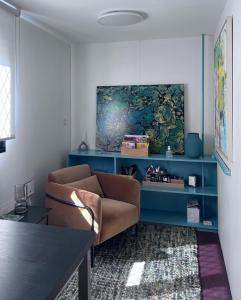 a living room with a couch and a table at LA PORTE ROUGE RBX in Roubaix