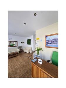 a living room with a couch and a table at Pension Villa ** in Comillas