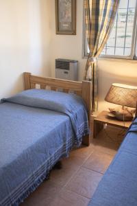 a bedroom with two beds and a window at La Cuadra - Puesto de Campo Argentino in Lobos +40 photos