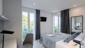 a bedroom with a bed and a large window at VILLA MON AMOUR by Villas Guide in Blato +38 photos