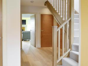 a hallway with a staircase and a wooden door at Veleta in Grange +23 photos