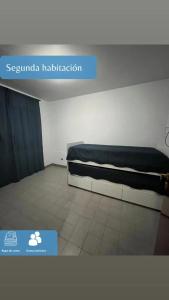 a bedroom with a bed in a room at Dpto Marce in Chacabuco