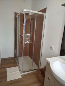 a shower with a glass door in a bathroom at Light Loft Marsciano in Marsciano