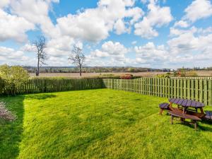 a wooden fence and a picnic table in a yard at Speed The Plough- Uk43631 in Grange