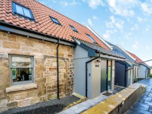 a stone house with a red roof at Speed The Plough- Uk43631 in Grange +22 photos