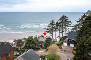 an aerial view of a beach with a red arrow at Ocean's Edge in Tillamook
