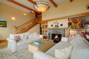 a living room with white couches and a fireplace at Ocean's Edge in Tillamook +27 photos