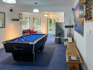 a billiard room with a pool table and a couch at Haven In The Burn in Newburn